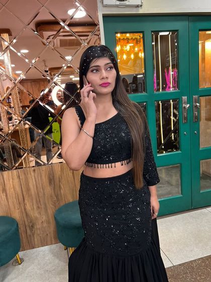 A candid moment, showing how our hair and makeup looks beautiful from every angle, even when you're on the phone.