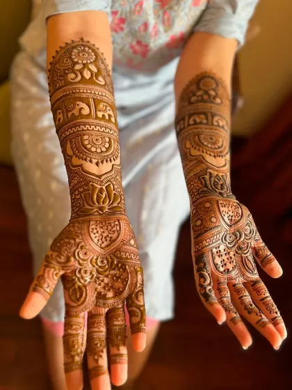 This photo showcases the rich stain of a design featuring elephants and lotus motifs.