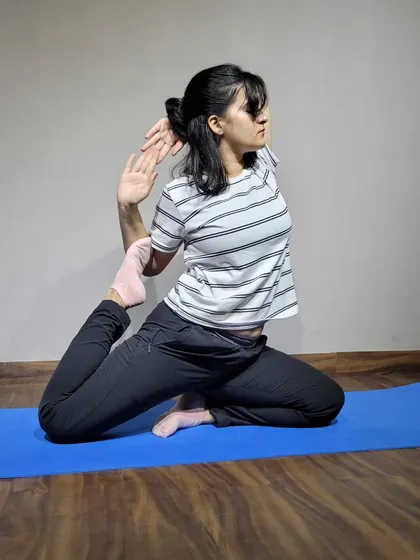 A deep stretch in the one legged king pigeon pose. This is an intense hip opener that I guide my clients through carefully. It's amazing for releasing stored tension in the hips and improving flexibility.