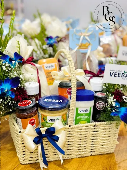 Styling hampers for a well-known brand like Veeba was a fantastic project. I designed these baskets to reflect Veeba's vibrant and delicious product line, using fresh flowers and branded elements to create a visually appealing gift for their corporate needs.