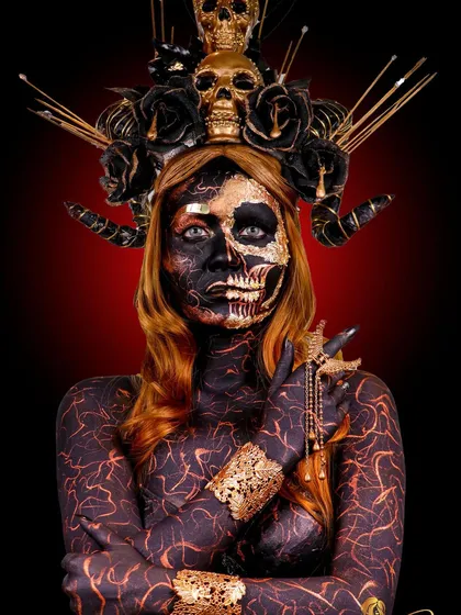 We witch you a Happy Halloween. This look is a deep dive into creative and SFX makeup, featuring body paint, gold leaf, and a custom-made skull headpiece.