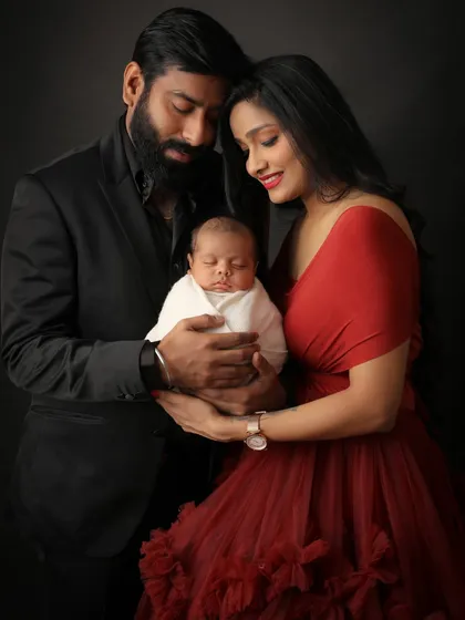 The journey comes full circle. This is that precious moment when parents hold their newborn for the first time in a family portrait. I used a dramatic, dark backdrop to draw all the focus to their connection and the beautiful details of their baby.