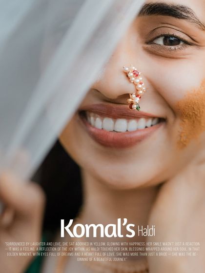 An elegant graphic for 'Komal's Haldi', featuring a close-up of her beautiful smile and traditional jewelry.