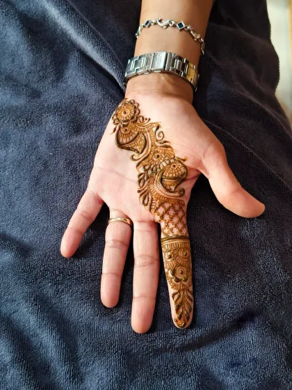 A beautiful, simple design for the mother of the bride. The peacock and floral bail is elegant and timeless.