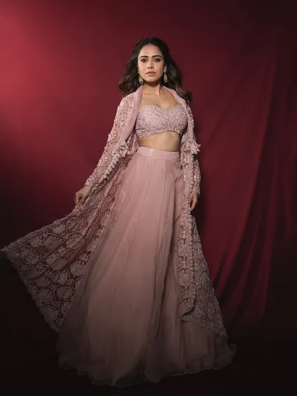 This dreamy pastel lehenga with a delicately embroidered jacket is a look I created for Nushrratt Bharuccha. It's a perfect example of modern indo-western styling for a sangeet or daytime wedding event.
