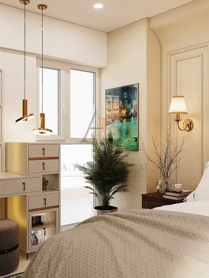 A chic vanity area next to the window, featuring a modern dresser, an arched mirror, and elegant pendant lights that add a touch of glamour.
