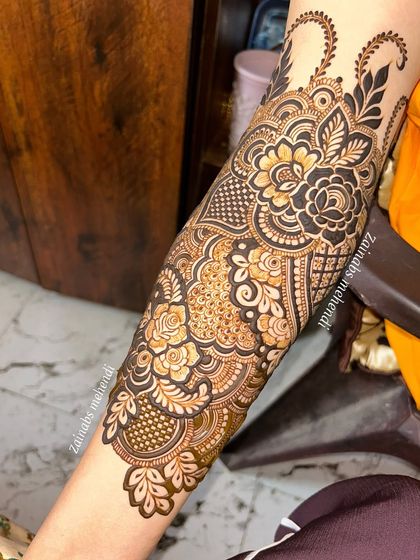 A detailed shot of the forearm portion of Arfa's bridal henna, showing the mix of dense patterns and open space.