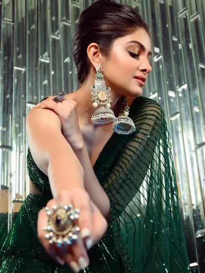 A detailed shot emphasizing the jewelry and makeup I helped conceptualize for the G&G festive cover. The large rings and statement earrings were selected to complement the grandeur of the outfit.