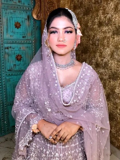 A serene portrait, her hair accessories and jewelry in perfect harmony.