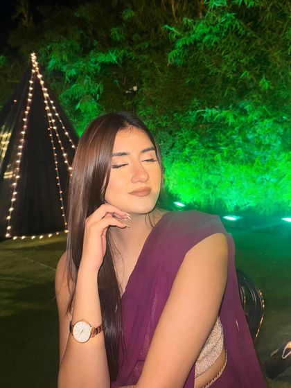 A candid shot in a deep purple saree from Indya, with my hair down and a gentle smile. Perfect "rishta picture" vibes.