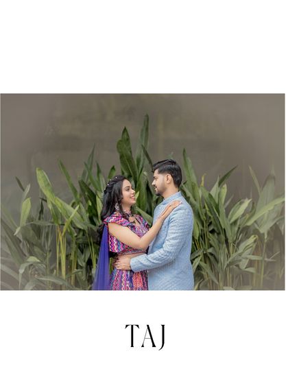 A lovely portrait of the couple in traditional attire, framed by a backdrop of green leaves. They are looking at each other with smiles, sharing a happy and quiet moment.