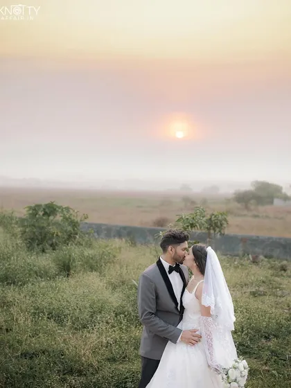 A tender kiss against a soft, golden sunset. This image showcases our ability to capture romantic, gentle moments during a Christian wedding ceremony, using natural light to create a dreamy atmosphere.