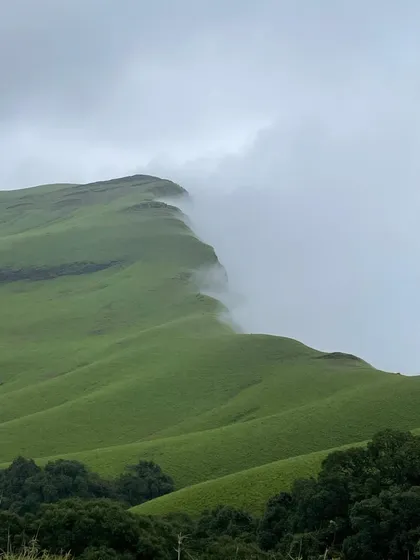 This is the view that makes every step of the climb worth it. The clouds rolling over the green hills of Netravati Peak in the Western Ghats is a sight you will never forget.