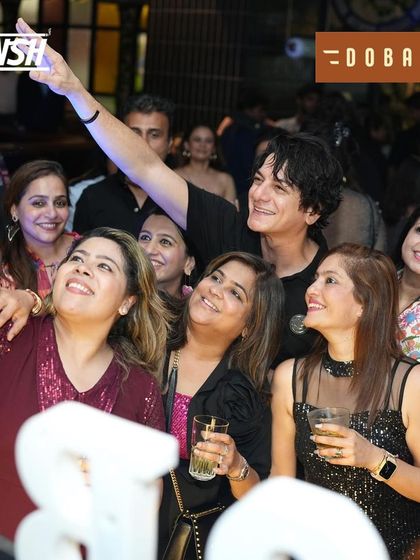 A big group selfie capturing the collective joy of a great night out at Dobaraa.