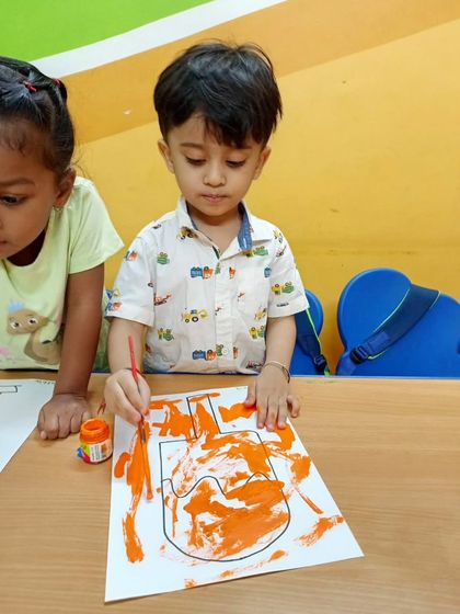 Life is a great big canvas, and we encourage our little campers to throw all the paint they can at it. Here, they are focused on turning a blank page into a beautiful piece of art.