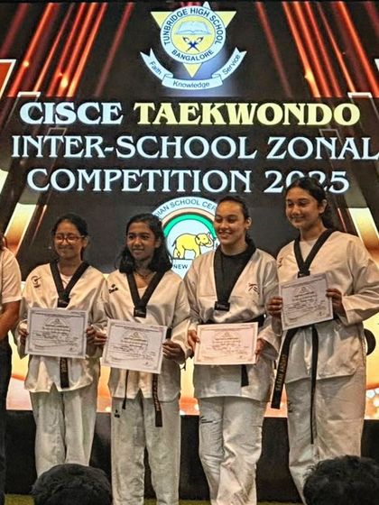 My female students proudly displaying their certificates and medals after a successful CISCE Inter-School Zonal Competition.