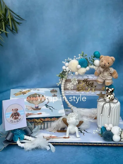 This super cute angel platter is handcrafted with love and perfection. The intricate detailing of jute, feathers, and a little teddy bear makes it a perfect way to celebrate a baby boy.