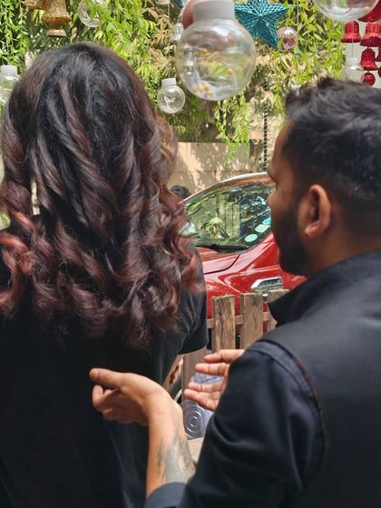 A stylist consulting with a male client about his new look. I believe in a collaborative approach to ensure the final result is exactly what you envisioned.