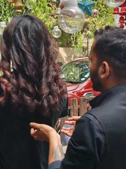 A stylist consulting with a male client about his new look. I believe in a collaborative approach to ensure the final result is exactly what you envisioned.
