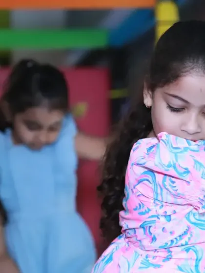 A candid shot of children playing together in an indoor play area. I focus on capturing the interactions and friendships that happen during these fun events.