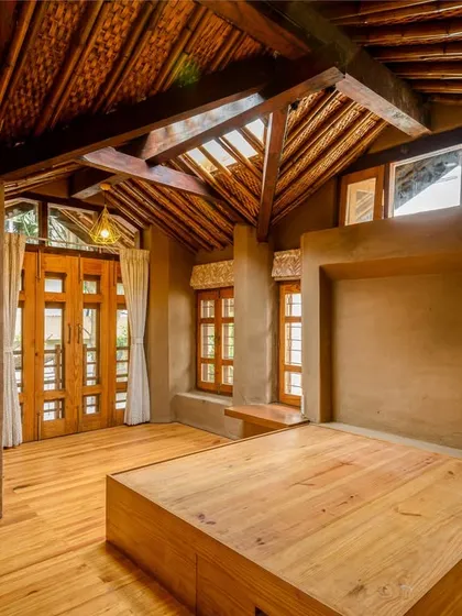 This is the second bedroom, featuring a large wooden bed platform and ample windows. My focus here was to show how the room connects with the outdoors through the large doors and windows, emphasizing the design's commitment to natural light and ventilation.
