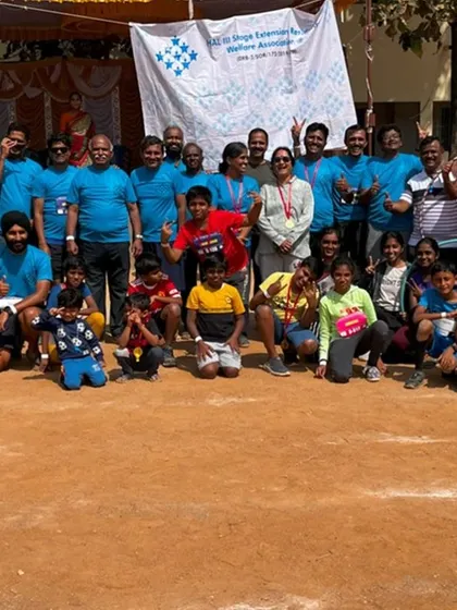 A large group photo from a community event. We are proud to be a diverse group, with members of all ages and backgrounds coming together.
