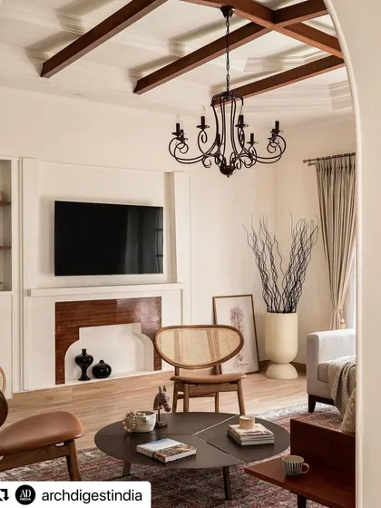 AD highlighted the living room's restored fireplace and custom TV unit, framed by classic wall molding. This detail shot shows how I integrate modern necessities like televisions into a space without sacrificing its traditional charm.