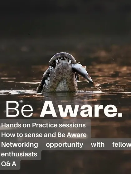 The core of the workshop is being aware. We engage in hands-on practice sessions in the field, learning to sense our surroundings and connect with fellow enthusiasts, as shown by this intense moment of a crocodile catching its meal.