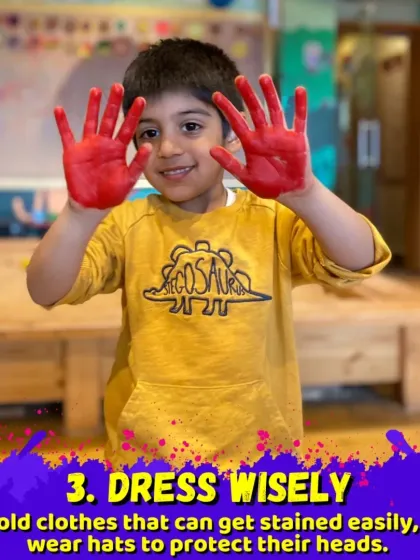 For Holi, we make sure to dress wisely in old clothes that can get stained. This little one is showing off his colorful hands, ready for more fun.