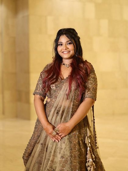 A full portrait of the bride's sister. She looks confident and beautiful, ready to celebrate the big day.