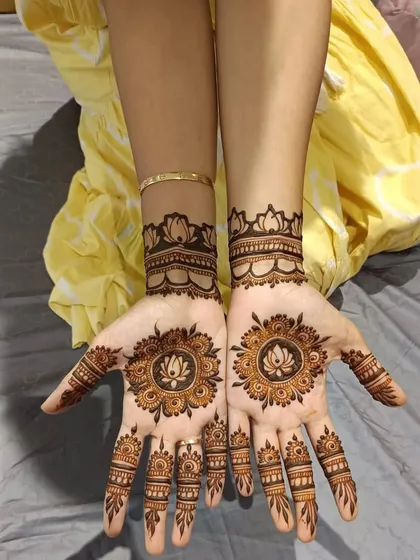 A beautiful and clean mandala design centered on the palm. The lotus motif is a classic choice that symbolizes purity and beauty.