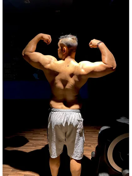 I practice what I preach. Building a strong, defined back requires dedication and the right exercises. This is the physique built by years of discipline and heavy lifting.