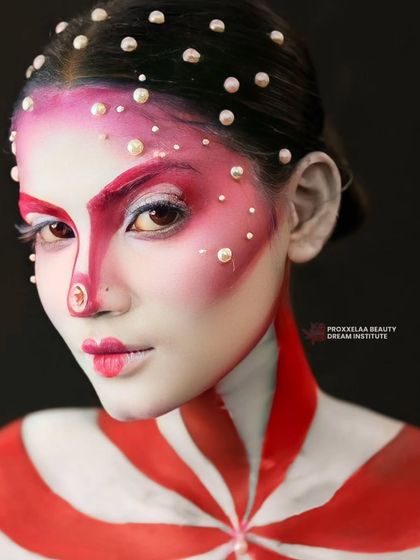 Embracing the winter season with a touch of frosty shimmer and bold graphic lines. This look is both festive and high-fashion.