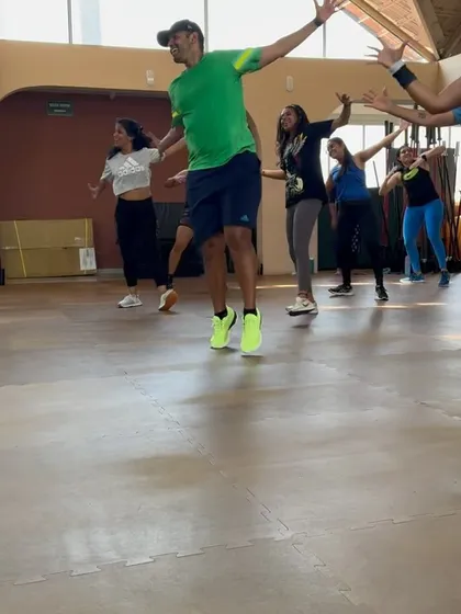 Getting some air during a high-energy routine. My classes are designed to be a full body cardio workout that gets your heart pumping.