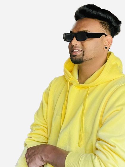 A clean, confident shot that represents my brand. I believe in being proud of who you are, and I bring that authentic energy to every performance.