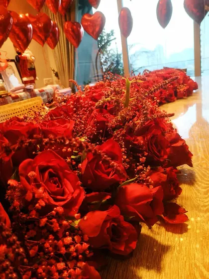 A close-up view of the fresh red roses used in the Valentine's decor, showcasing the quality and attention to detail.