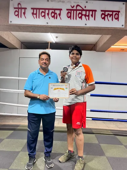 Another proud moment with my boxer Jagruti, celebrating her win with a medal and certificate. We document every achievement as part of our club's legacy.