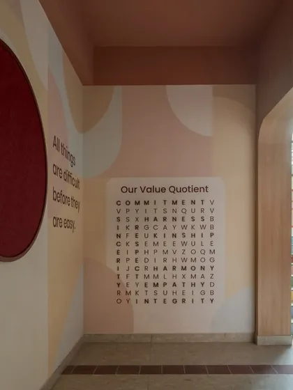 We translate a school's ethos into its physical space. This interactive "Value Quotient" word search puzzle in the corridor is a perfect example. It's a simple, engaging way to embed core values like commitment, empathy, and integrity into the students' daily journey through the school.