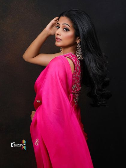 This image of Priyamani shows her looking back, creating a sense of movement and intrigue.