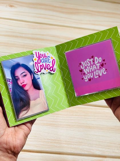 Another page from the mini album, showing a different color scheme and a "You are loved" sticker.