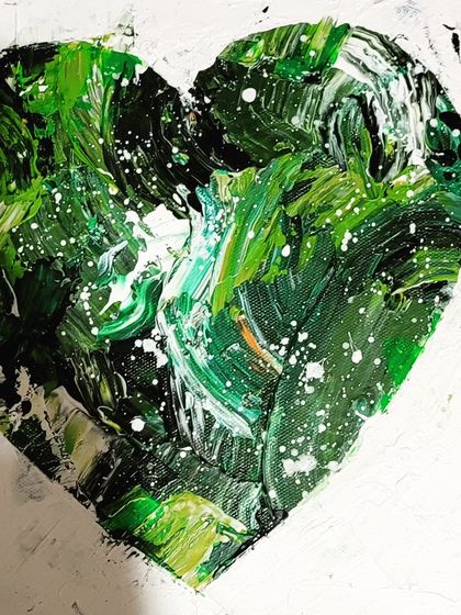 A duplicate shot of the vibrant green heart, highlighting its rich texture and dynamic composition.