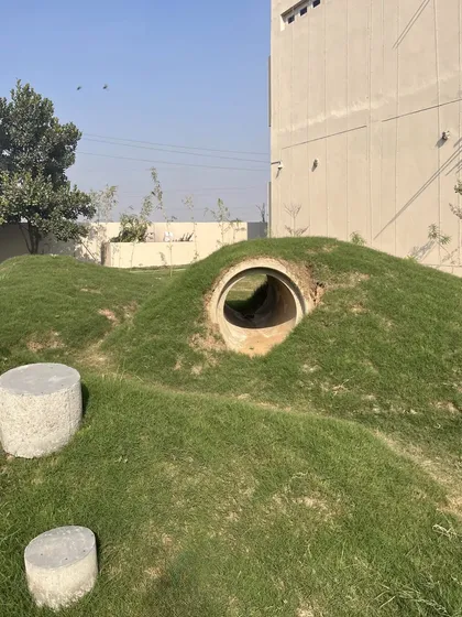 Another angle of the play mounds and tunnels. We wanted to create a landscape that sparks imagination, where kids can run, hide, and make the space their own.