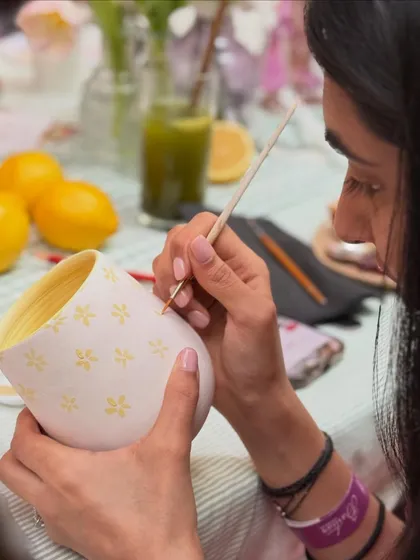 Adding small, cheerful designs to a mug. Our painting events are a relaxing and creative way to spend an evening.