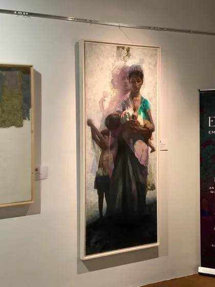 A wider shot of my painting "Love & Hunger" on display at the gallery.