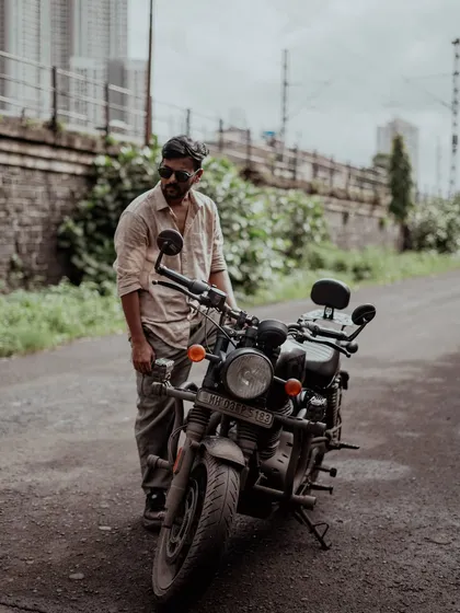 A personal, retro-styled portrait of me with a classic motorcycle. This shot reflects my own connection to the old-school charm and lifestyle that I love to capture in my photography.