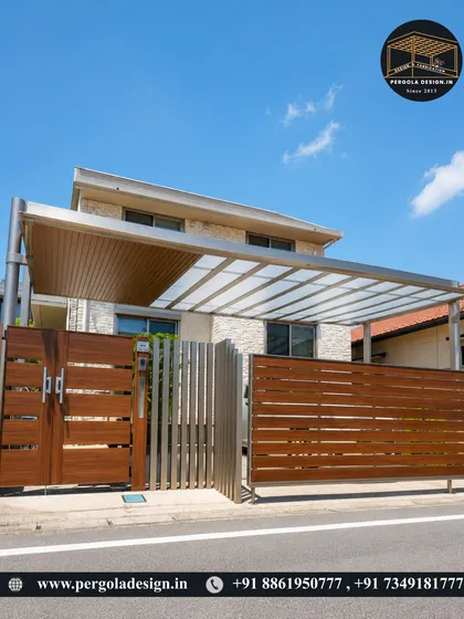 This carport combines a sleek aluminium frame with a polycarbonate roof, creating a lightweight and contemporary look. The structure is paired with a modern gate and fence, demonstrating a complete and cohesive exterior design solution for a modern home.