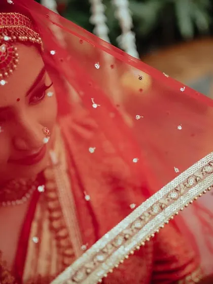 This artistic shot of my bride Yukthi captures the serene and traditional mood of her Telugu wedding ceremony. The focus is on her expressive eyes and the beautiful details of her bridal attire.