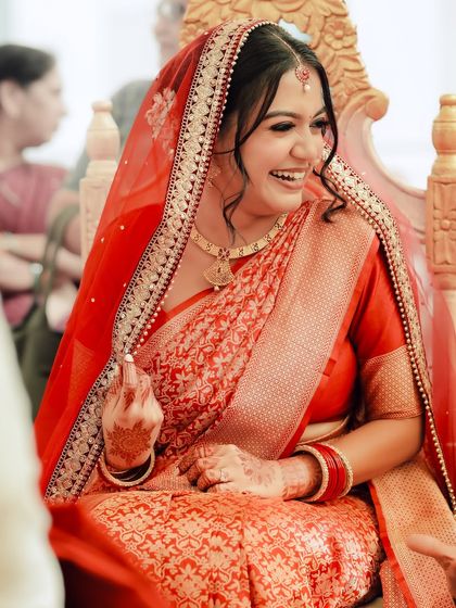 A candid laugh from the bride during the ceremony, looking completely at ease and radiant.