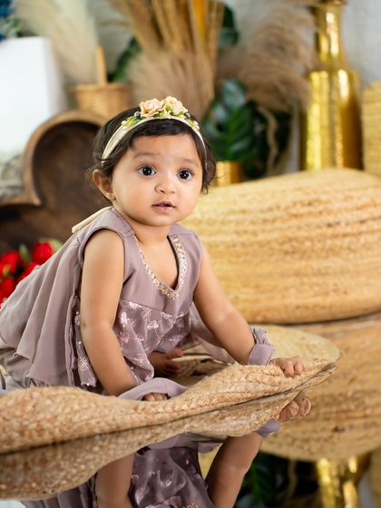 A creative portrait using a mirror to capture the reflection of a toddler in a beautiful boho setting.