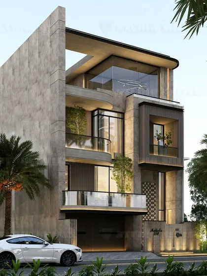 An angled view of the Janakpuri project, highlighting the massive concrete side wall that anchors the structure. The curved balconies and glass create a softer, more fluid counterpoint.